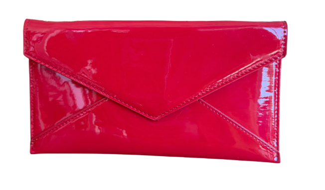 Red patent leather clutch bag on a white background