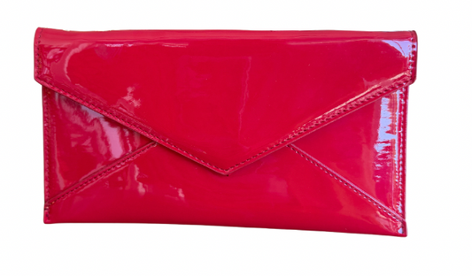 Red patent leather clutch bag on a white background